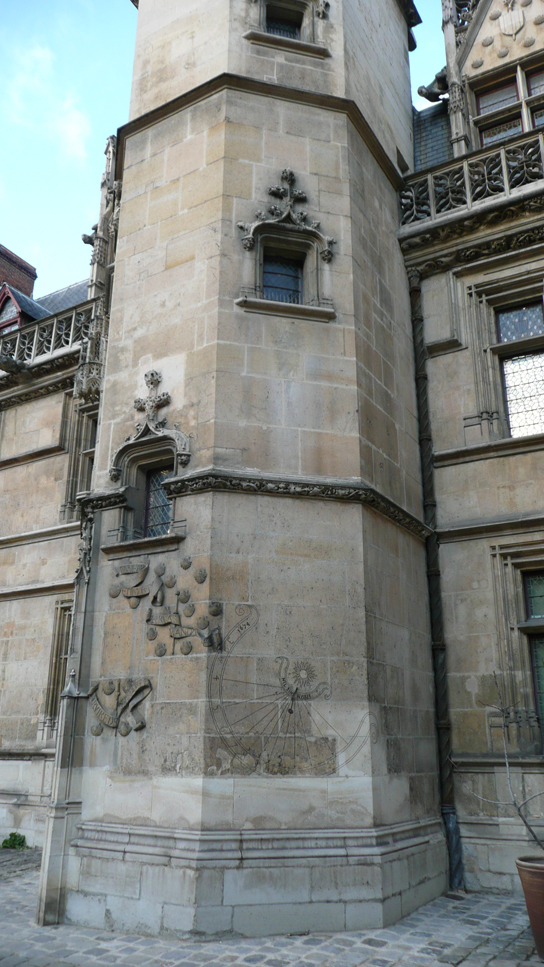 Sundial carved into the stairwell wall